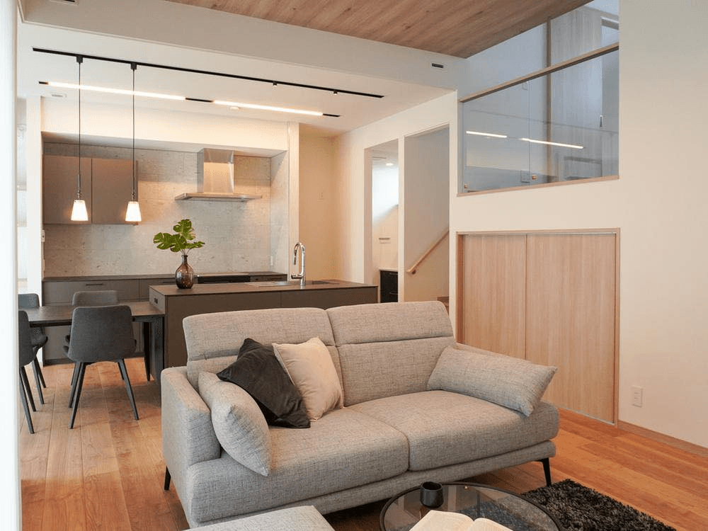 Bright open-plan living room flowing into a modern kitchen — a property brokered by AKI HOME in Osaka